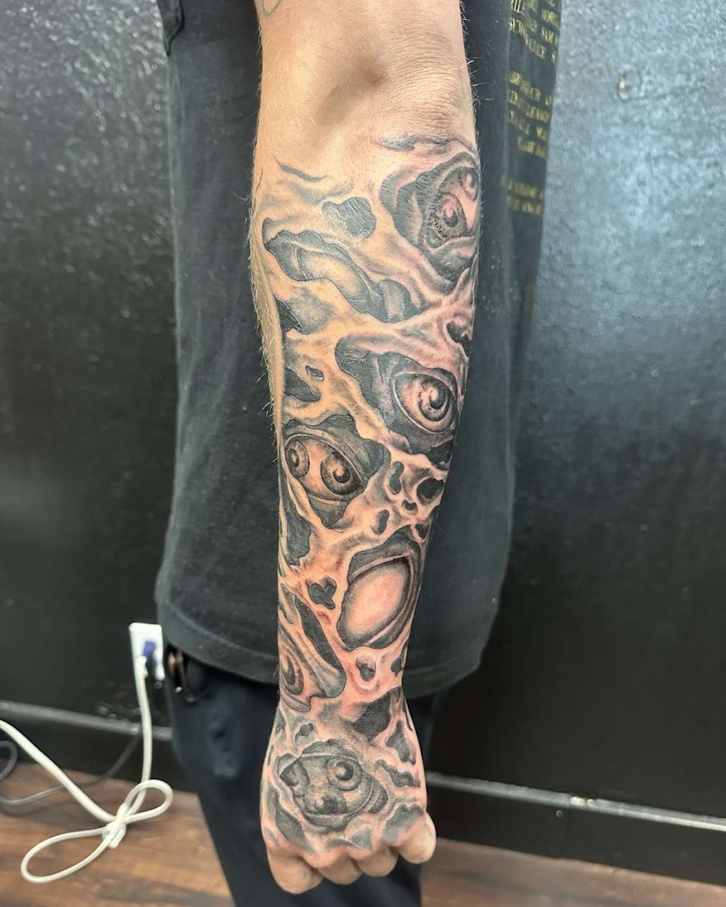 Black and grey snake sleeve tattoo